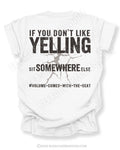 White t-shirt shown from the back featuring a large distressed black graphic that reads “If You Don’t Like Yelling Sit Somewhere Else #Volume Comes With the Seat” with a cracked texture effect.