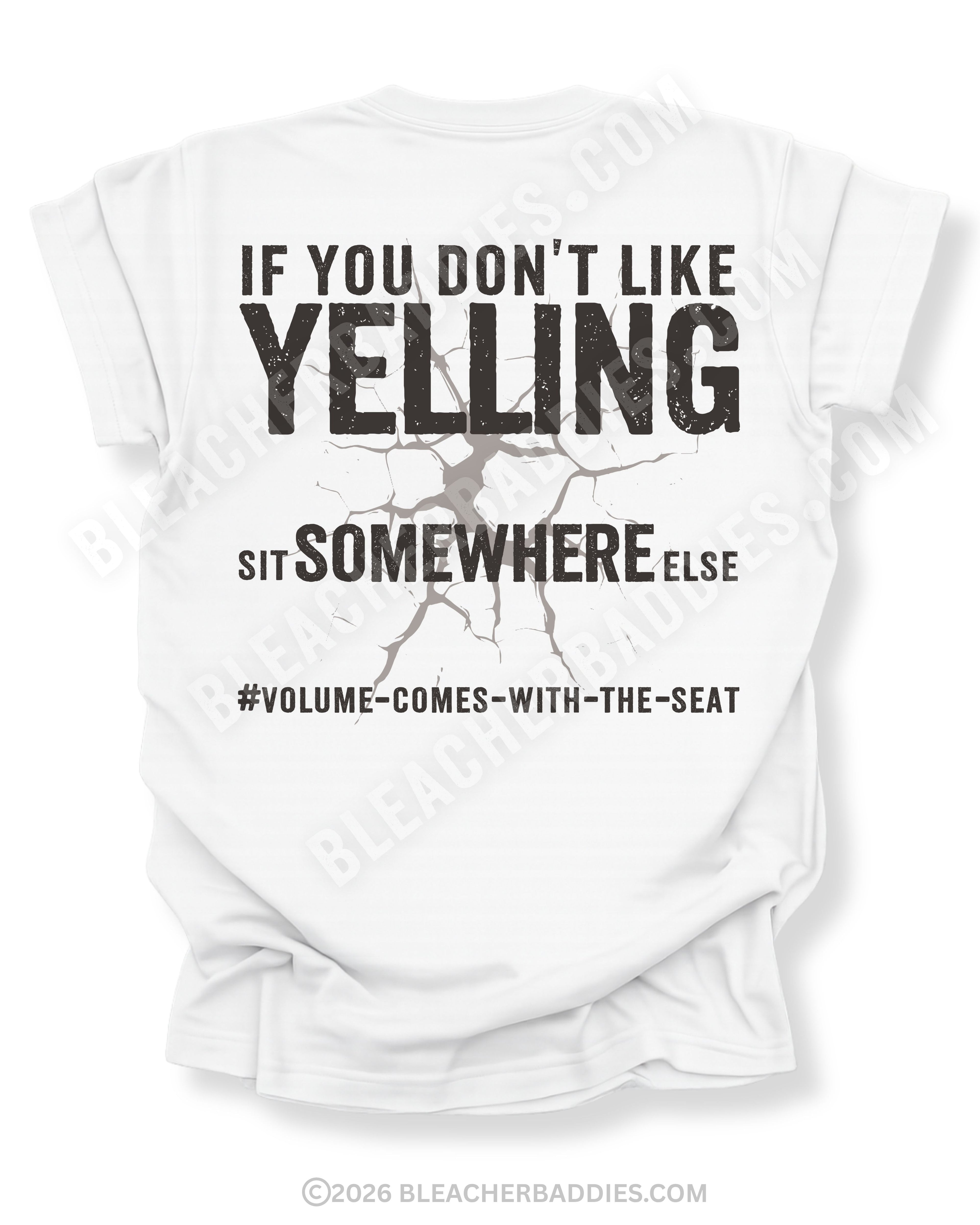 White t-shirt shown from the back featuring a large distressed black graphic that reads “If You Don’t Like Yelling Sit Somewhere Else #Volume Comes With the Seat” with a cracked texture effect.