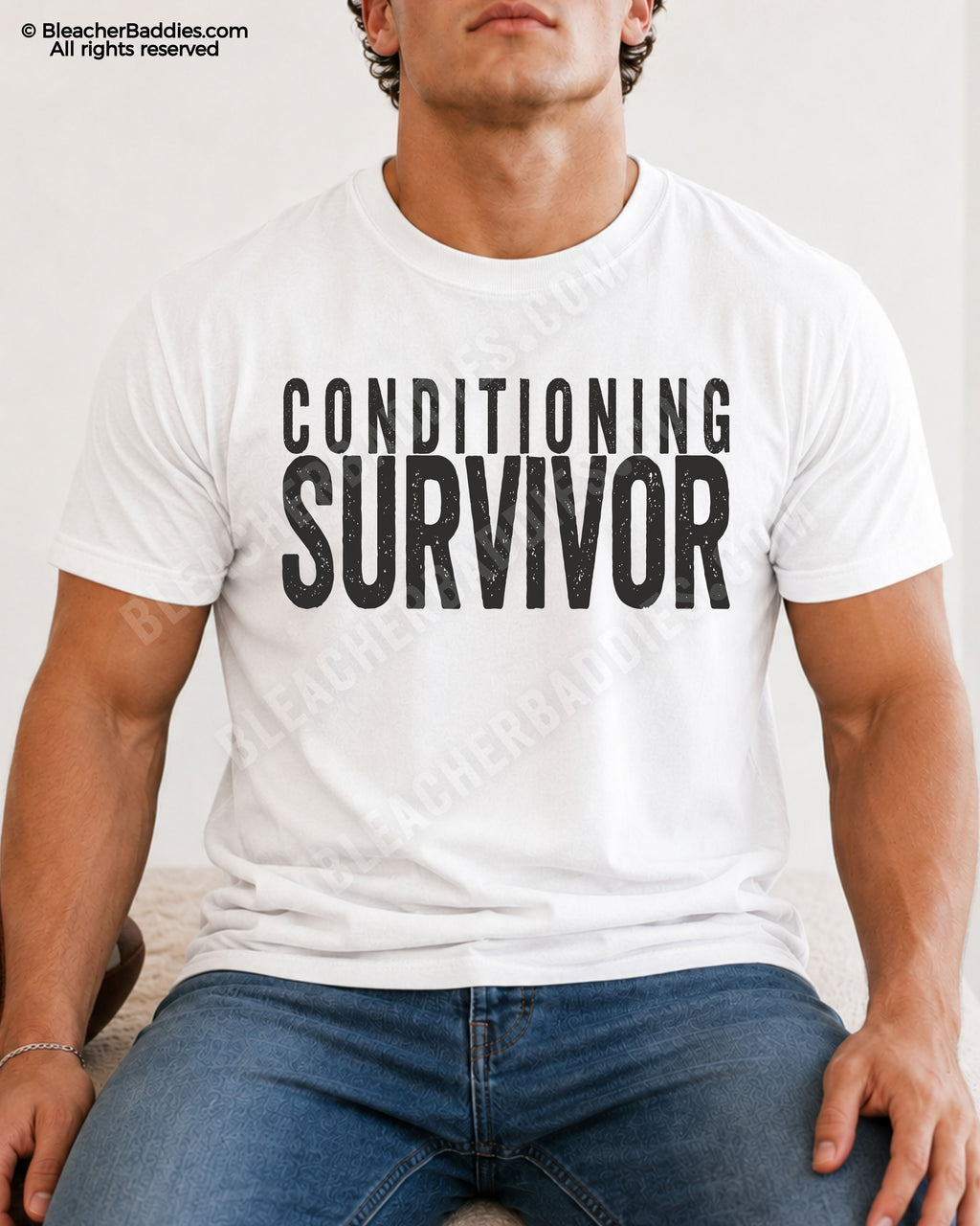Male football player model wearing a white Comfort Colors “Conditioning Survivor” football shirt with distressed lettering.
