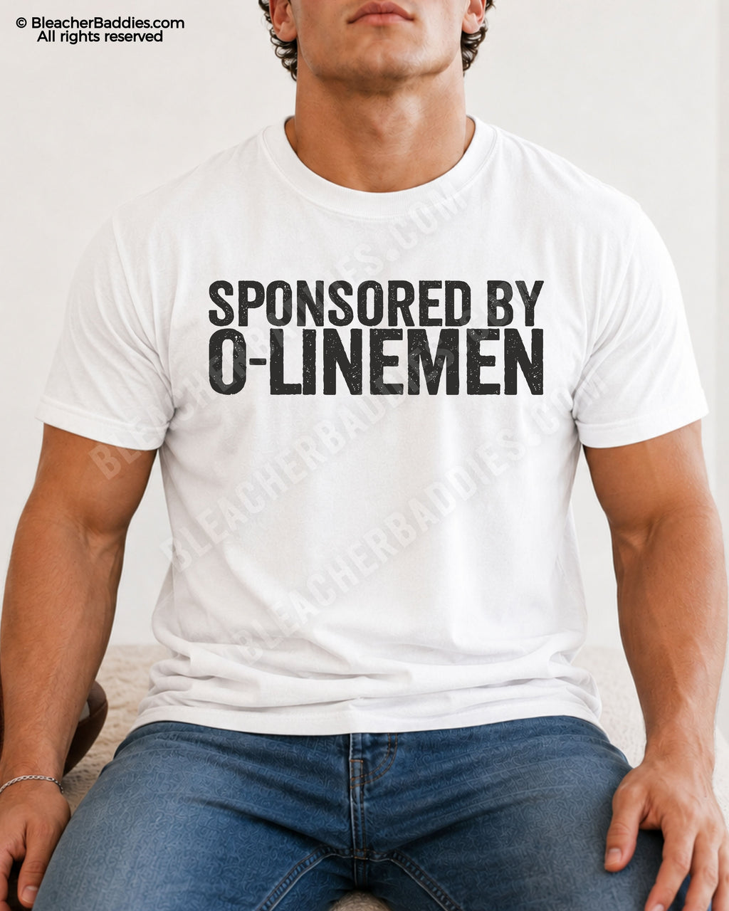Male model wearing a white Comfort Colors quarterback t-shirt with the funny "Sponsored by O-Linemen" football graphic.