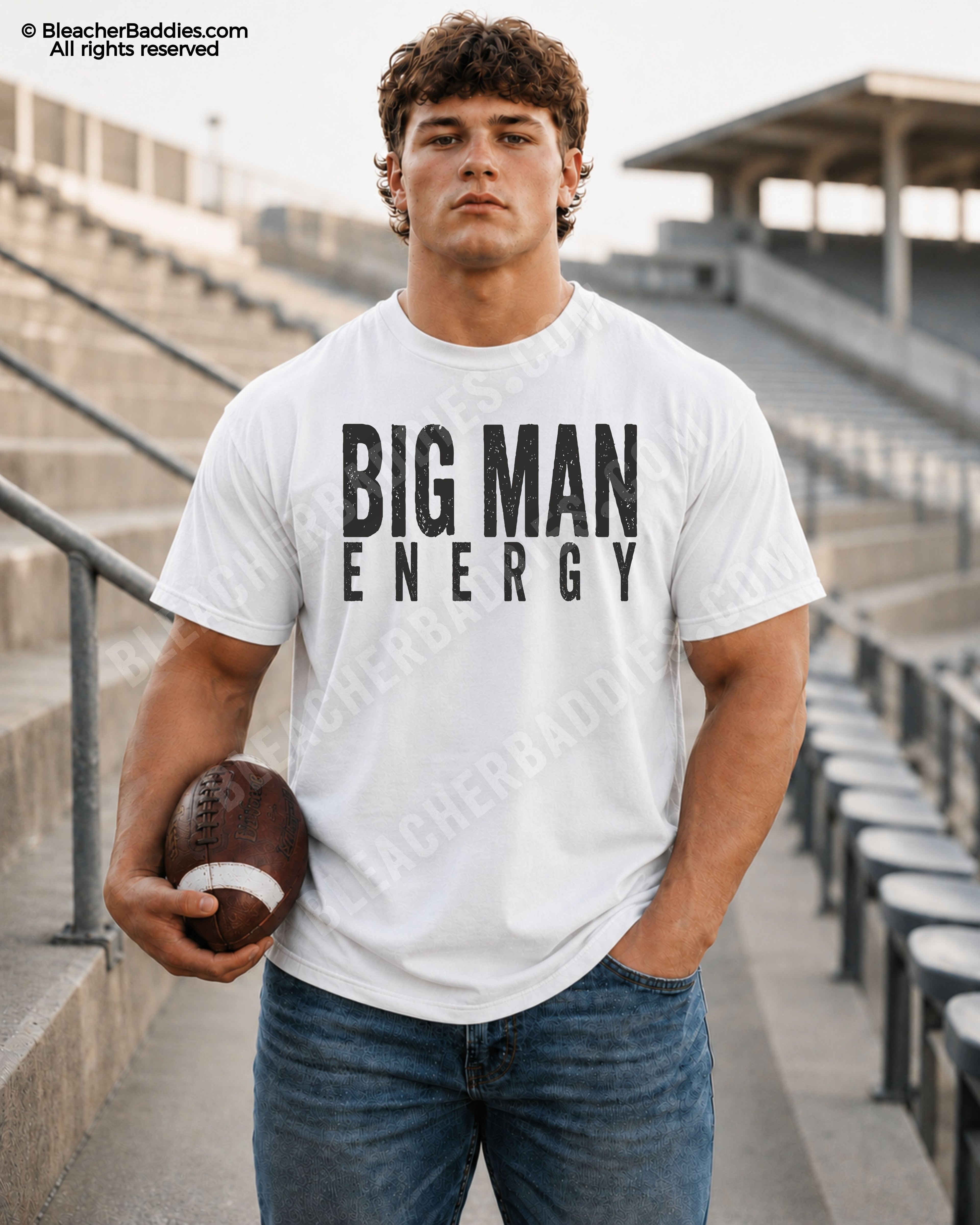 Male football player standing in stadium wearing a white Comfort Colors Big Man Energy football shirt with distressed black typography. 