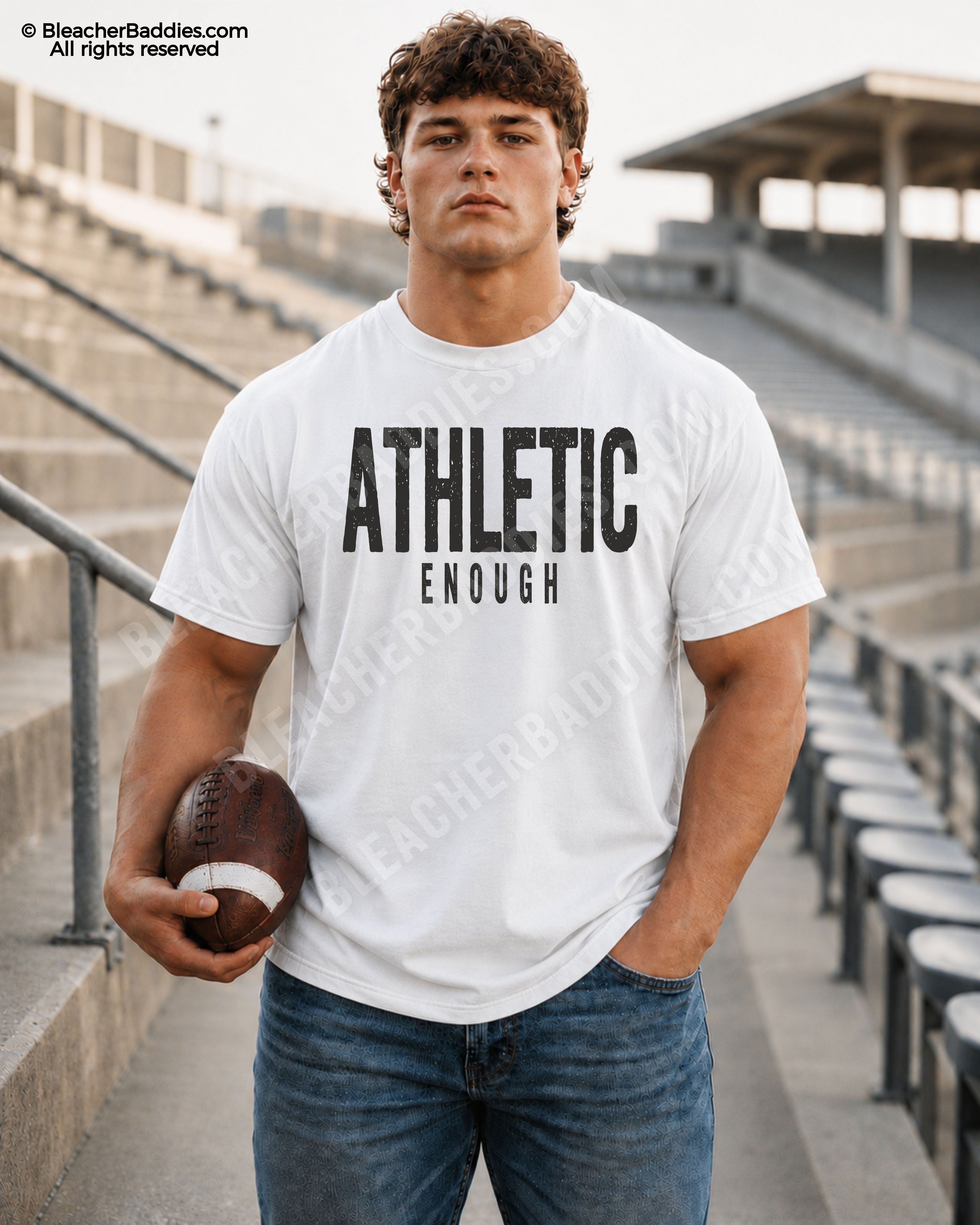 Football player standing in stadium wearing a white Comfort Colors “Athletic Enough” game day shirt with distressed black lettering and athletic football aesthetic.