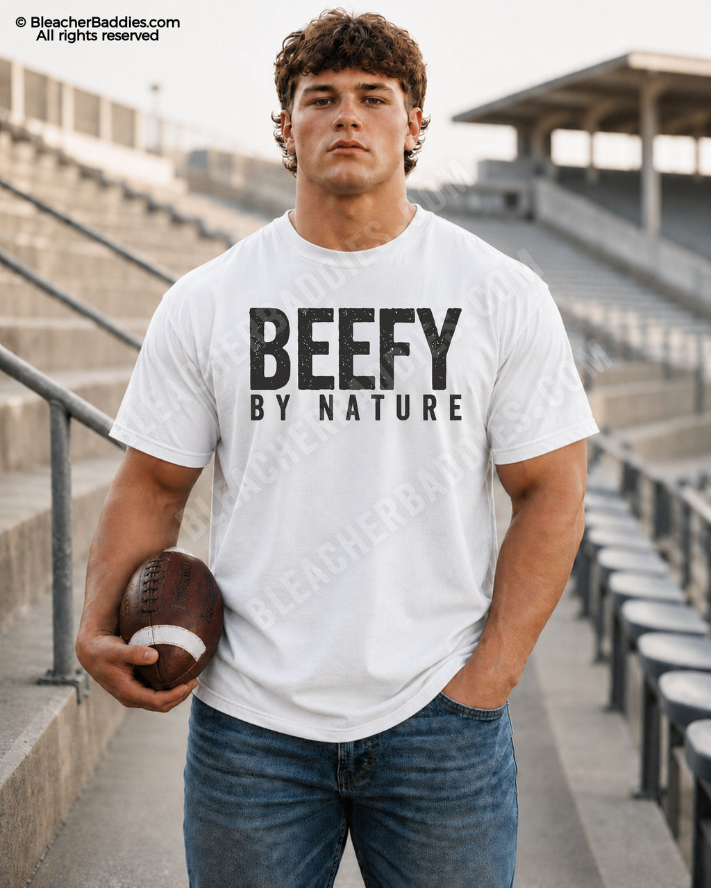 Football player standing in stadium wearing a white Comfort Colors “Beefy By Nature” game day shirt with distressed black lettering and football aesthetic.